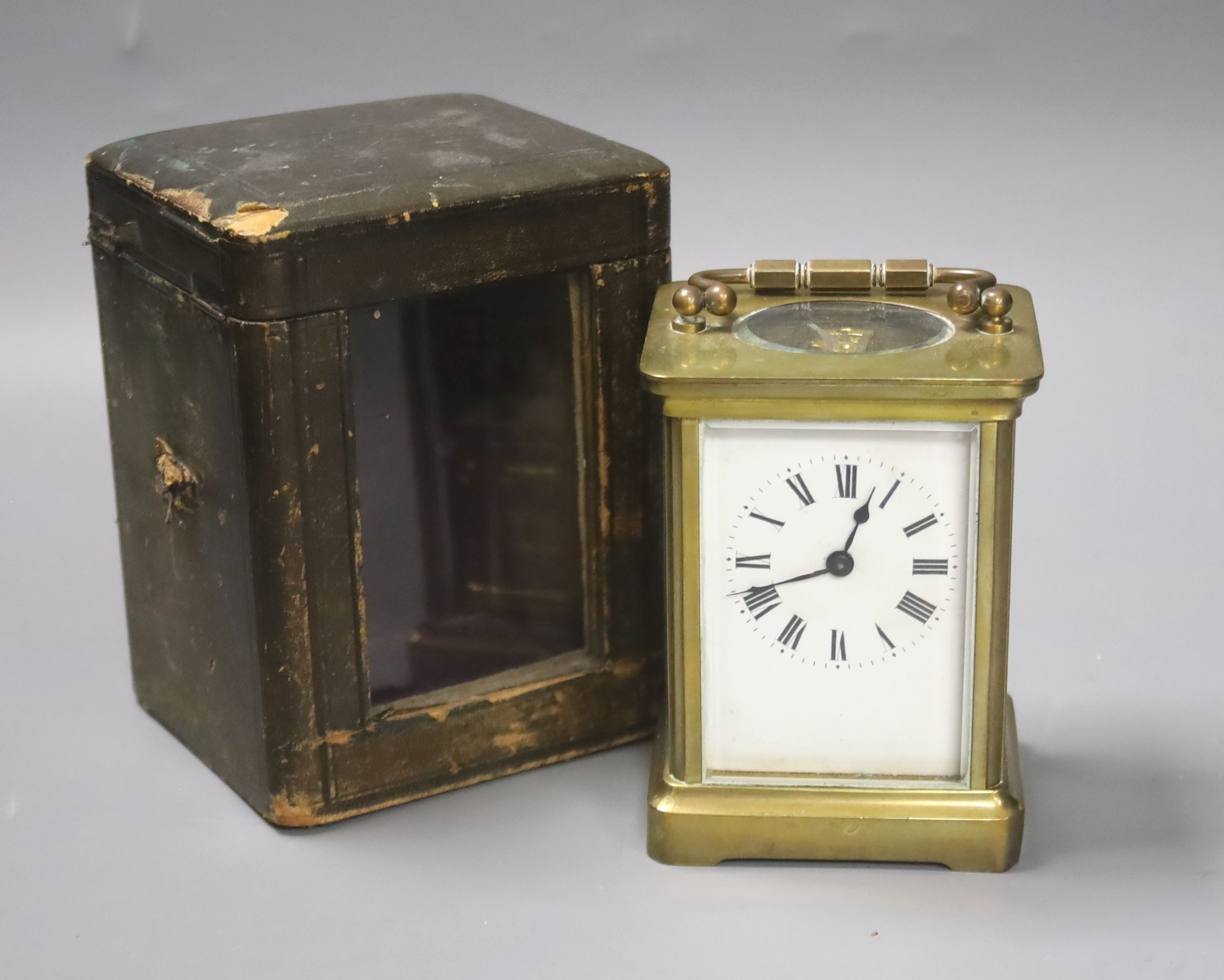 A cased brass carriage timepiece